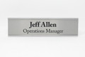 Brushed metal office signs with frame. Made in the USA.